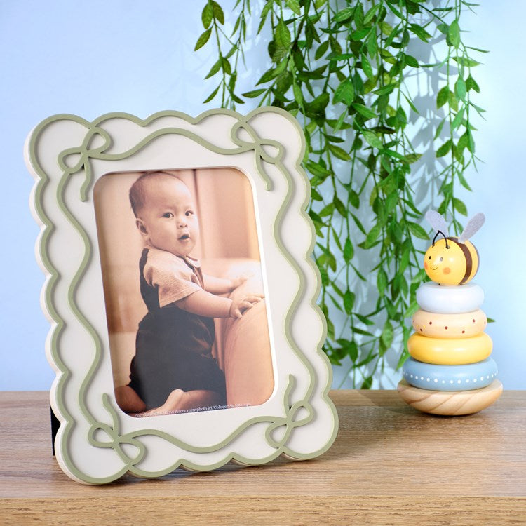 Scalloped Frame with Green Bows