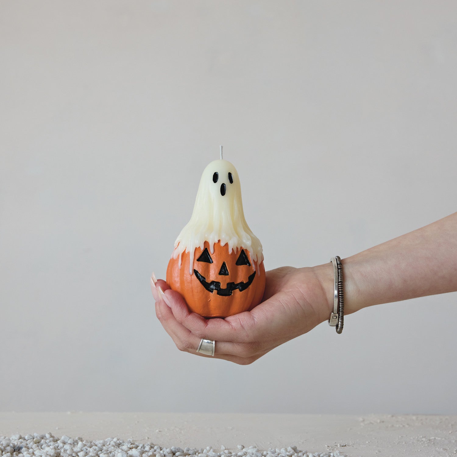 Unscented Ghost on Top of Jack-O-Lantern Shaped Candle in Cello Bag with Raffia Tie
